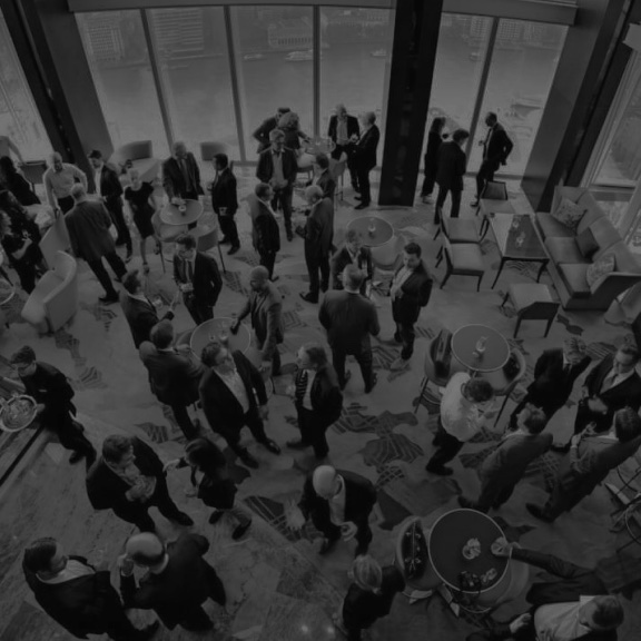 A crowd gathered at an evening celebration