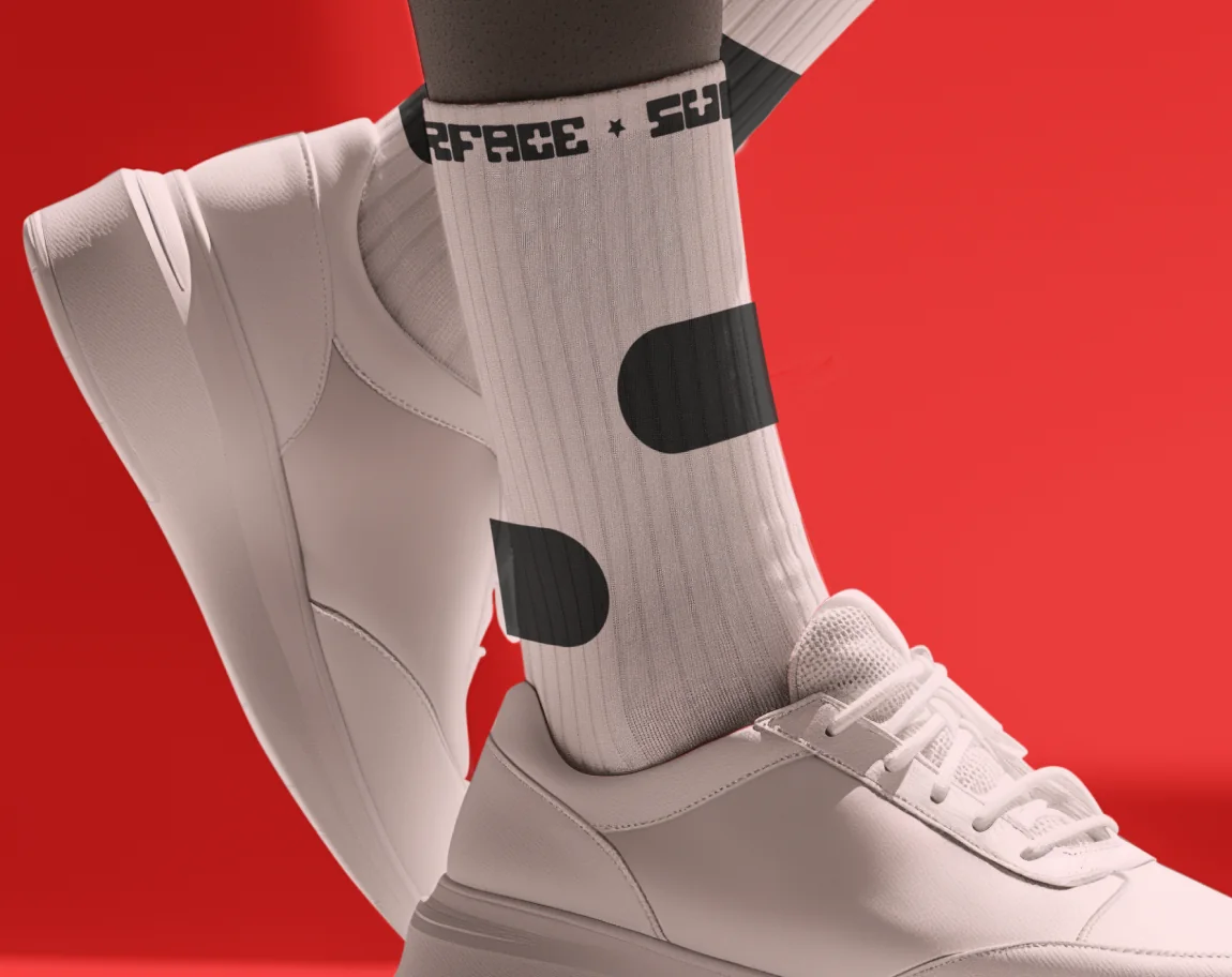 A white Surface sock and sneaker against red.