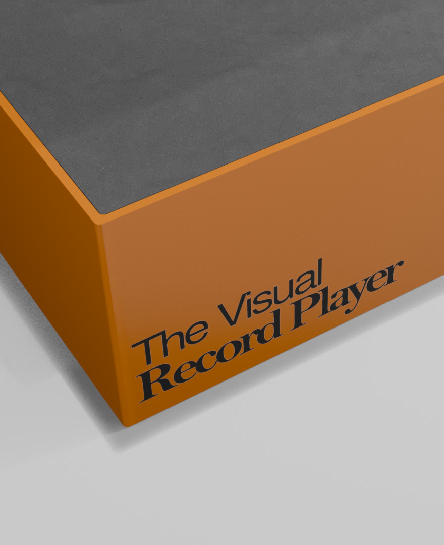 The book closed: an orange case with The Visual Record Player printed on its side
